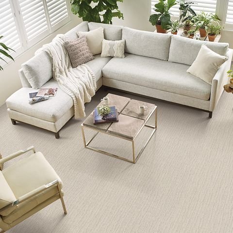 Living room with a white couch in the middle from Excel Carpet LTD in Commack